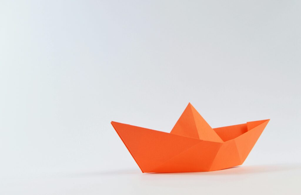 An orange paper boat